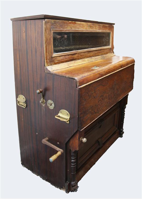 A late 19th century coin operated cylinder music cabinet,